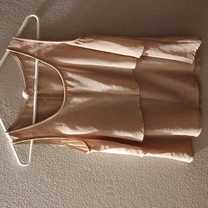 It's a beautiful tank top I would say you could combine it with a necklace